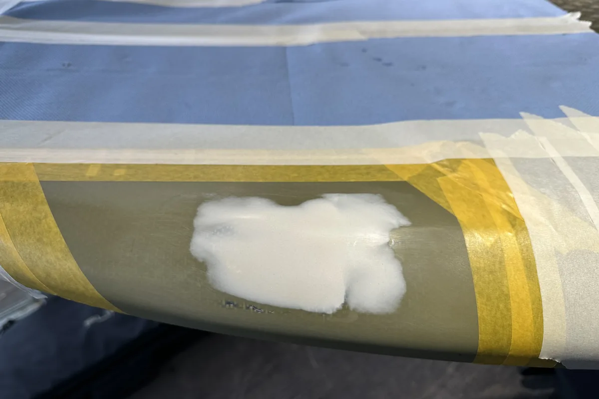 eFoil Doctor — masked-off rail of a Fliteboard eFoil during repair work